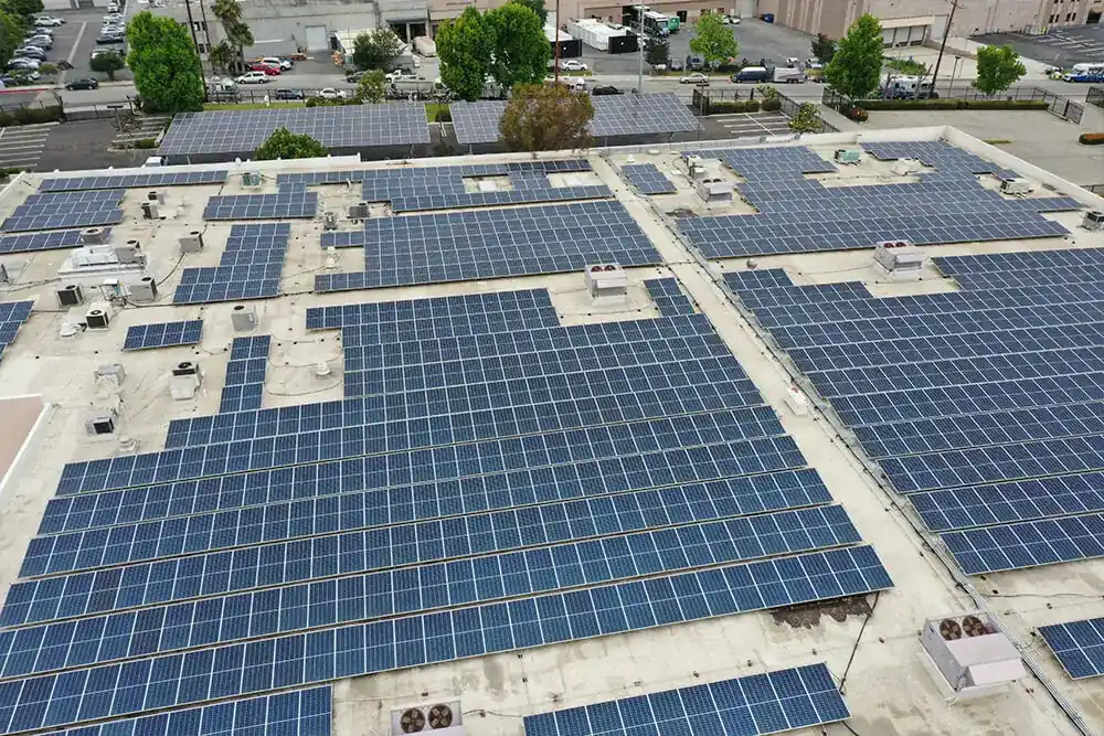 Rows of solar panels across a commercial rooftop in the San Fernando Valley