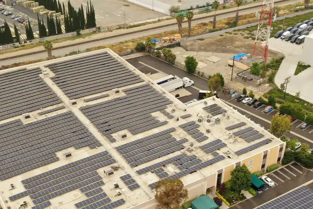 Aerial of a Chatsworth commercial building with a full rooftop solar array