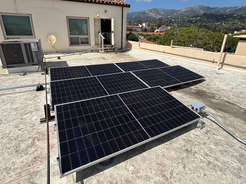 Solar panels on the flat roof of a commercial office building