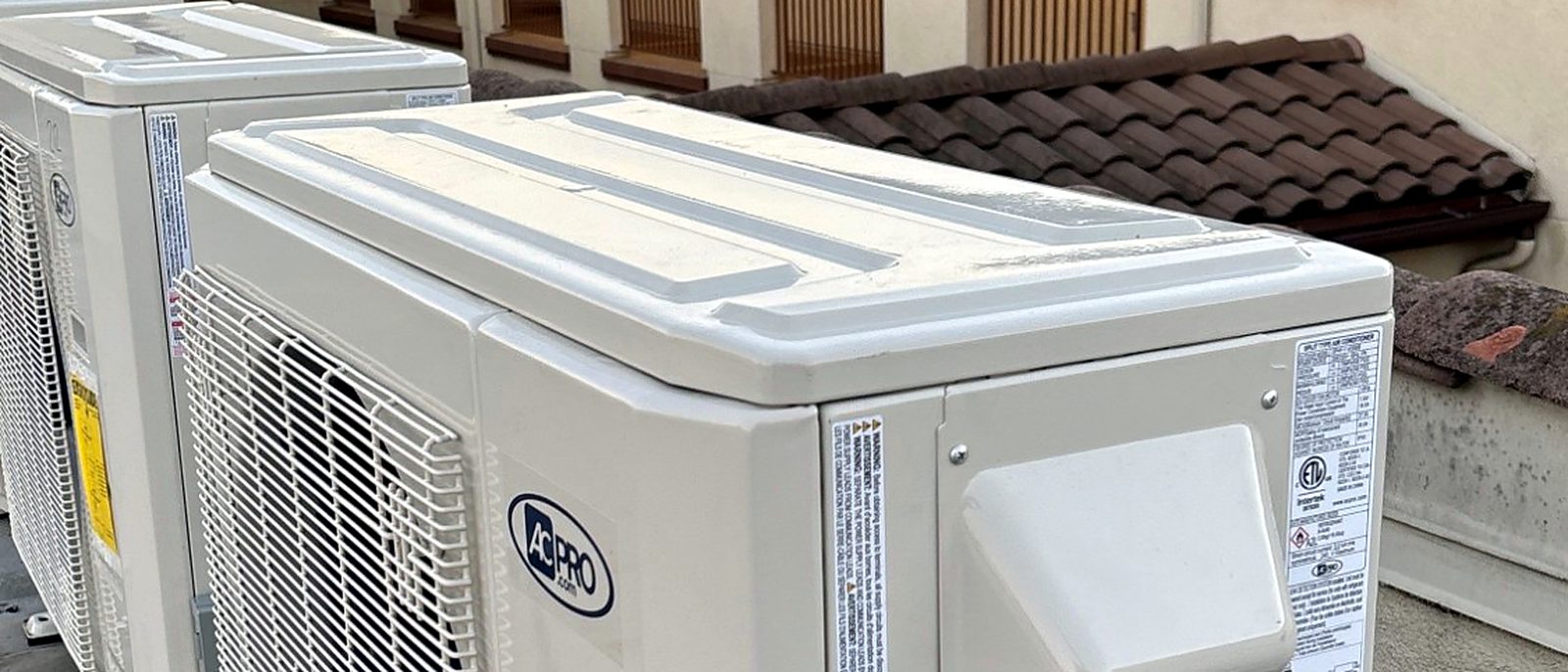 Heat-pump condensers installed on a rooftop by Current Energy