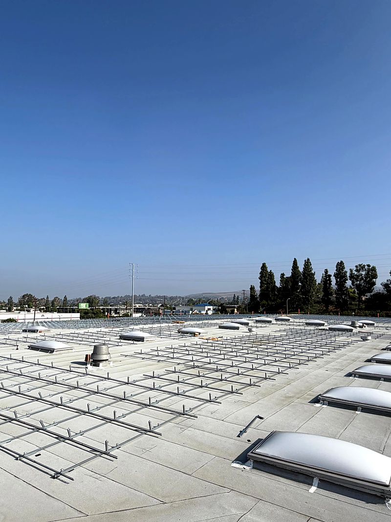 Solar racking rows set around rooftop skylights