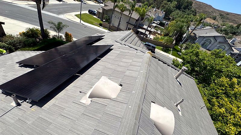 Solar array on a grey tile roof seen from above