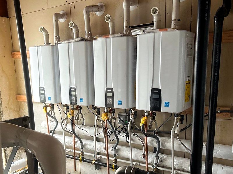 Bank of four Navien tankless water heaters