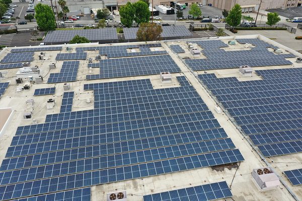 Rows of solar panels covering the flat roof of the Chatsworth building