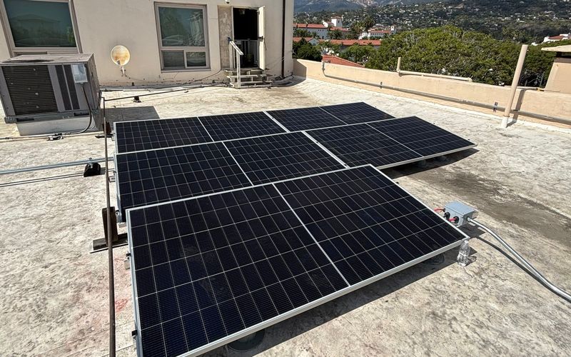 Solar panels on the flat roof of a commercial building